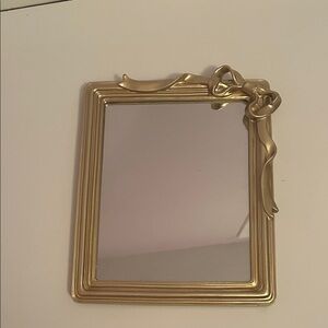 Elegant Gold Mirror with Ribbon Detail